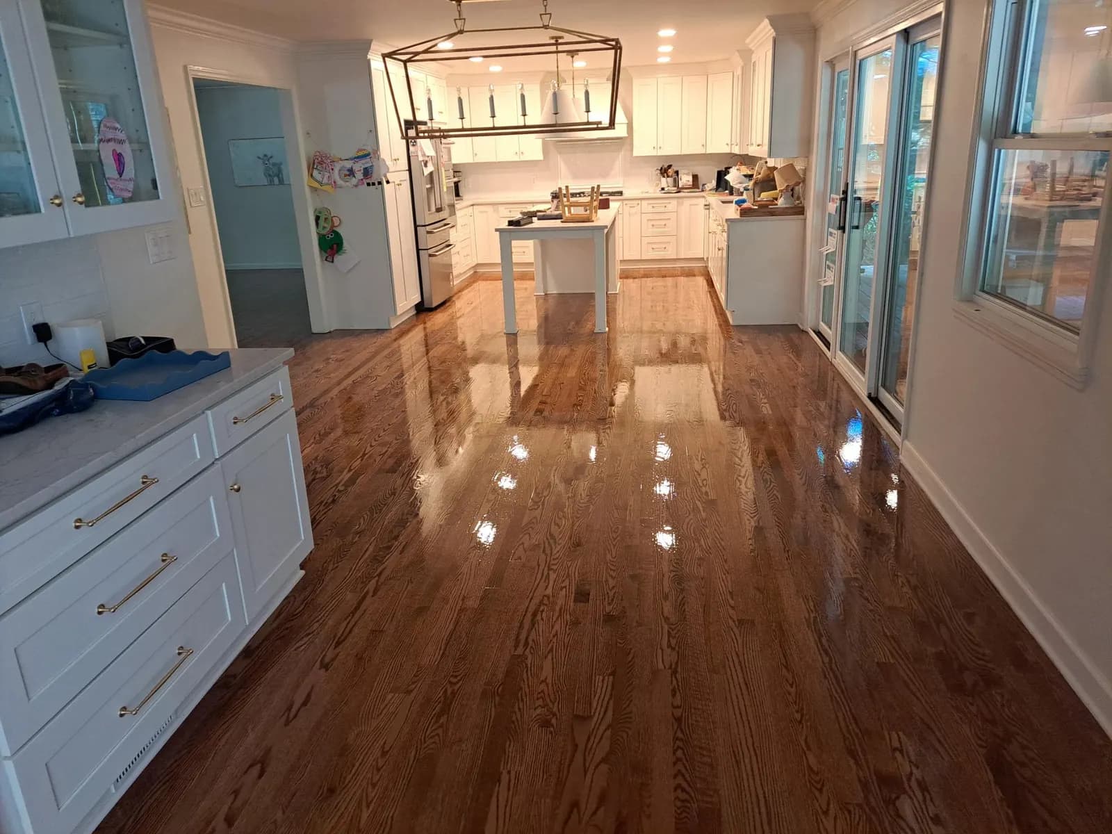 LED-cured hardwood floor finish being applied in Knoxville TN