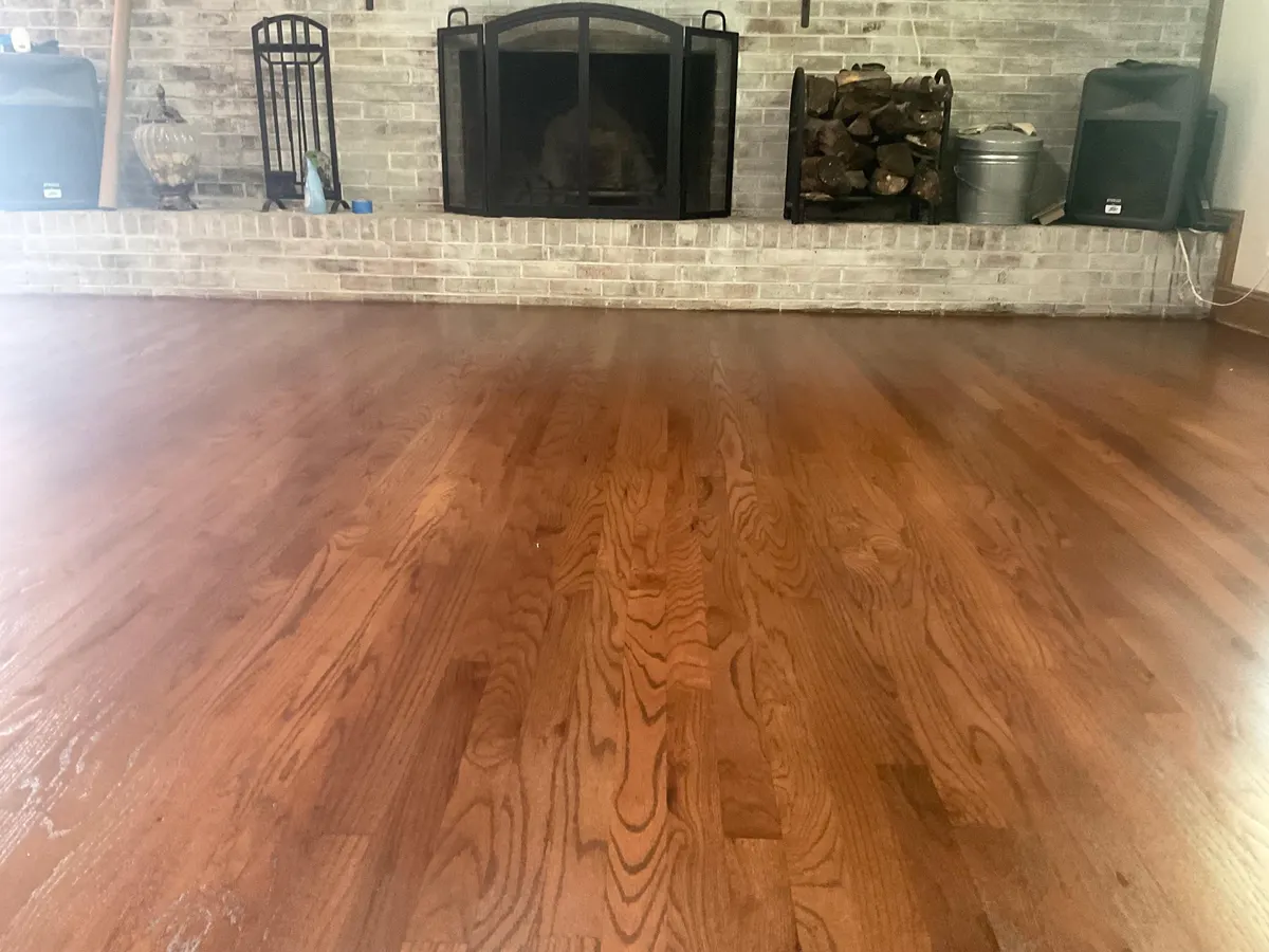 Rich oak flooring by fireplace in Knoxville home